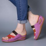 Hole-crossing open-toe wedge slippers
